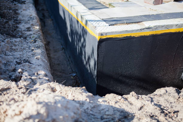 Professional Waterproofing technician working in Fall River, WI